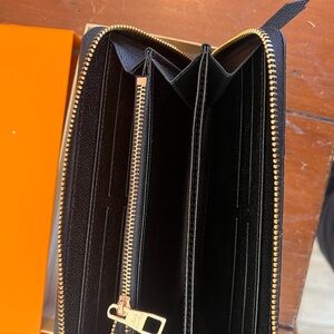 Black Zip-Around Wallet with Gold Accents